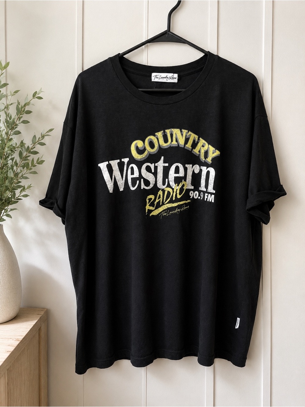 The Laundry Room Black Tee with White & Yellow Graphic